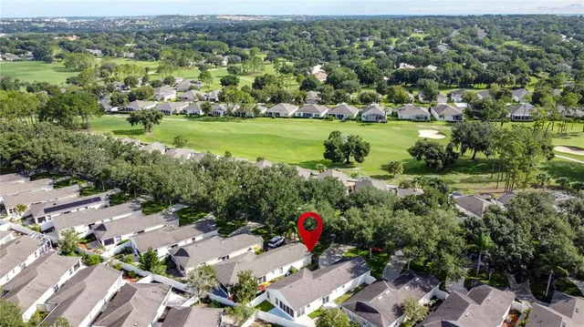 a view of a house with a yard and garage
