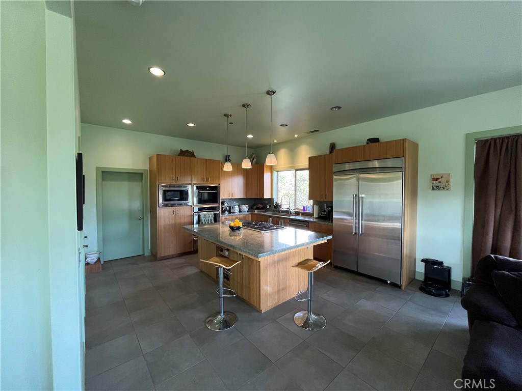 240 Rich Gulch Road Oroville, CA 95965 - Photo 16 of 49 a kitchen with a refrigerator and a sink
