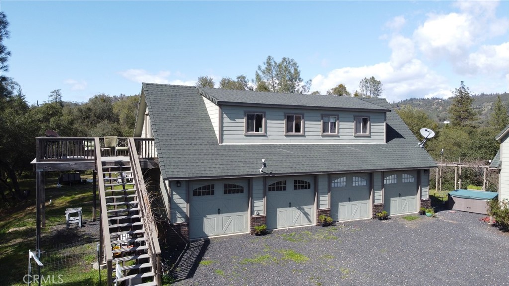 240 Rich Gulch Road Oroville, CA 95965 - Photo 2 of 49 a view of a house with a barbeque and large trees