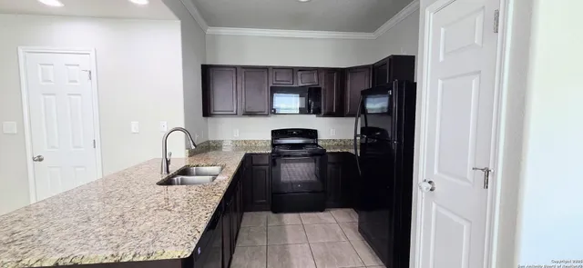 a kitchen with granite countertop lots of counter top space