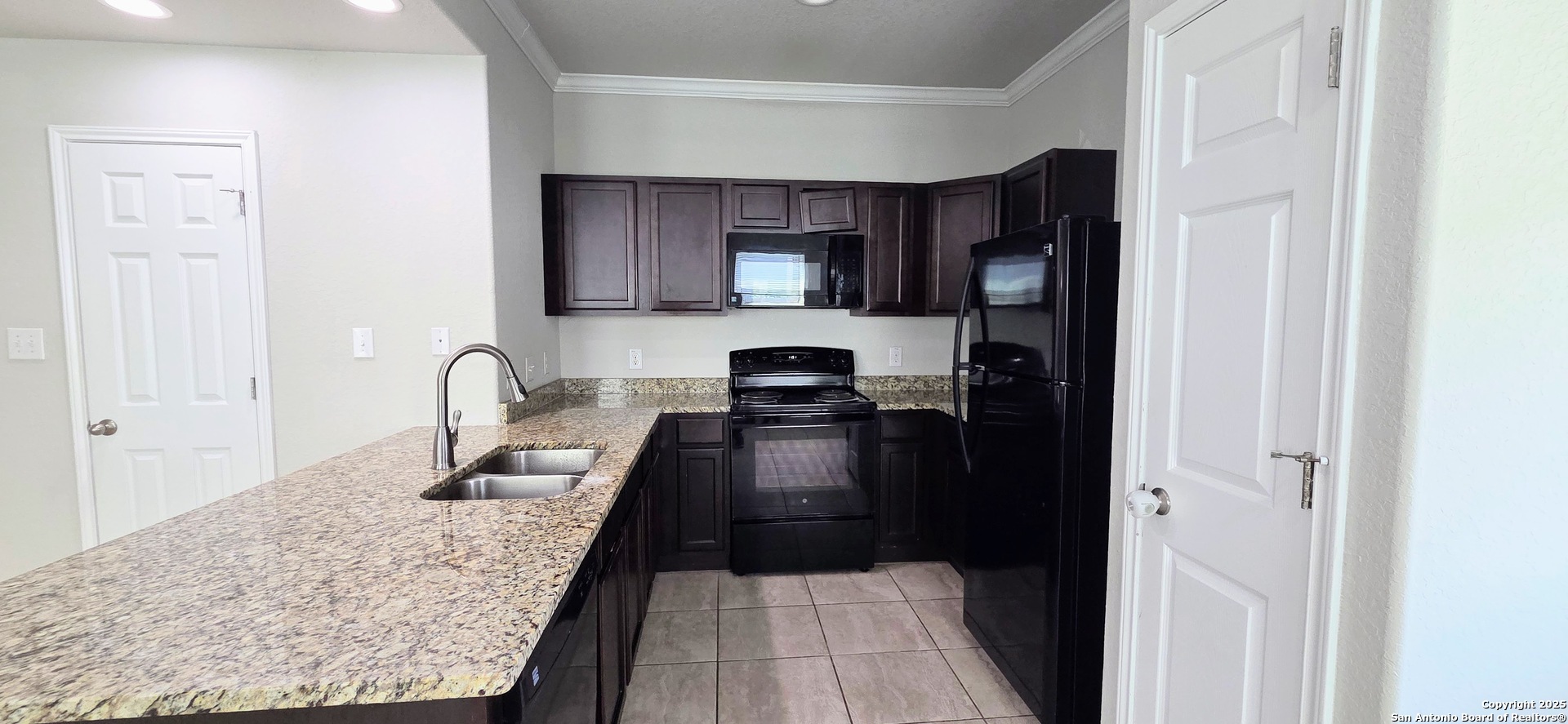 16906 Dancing Ava, Unit 1 Selma, TX 78154 - Photo 3 of 7 a kitchen with granite countertop lots of counter top space