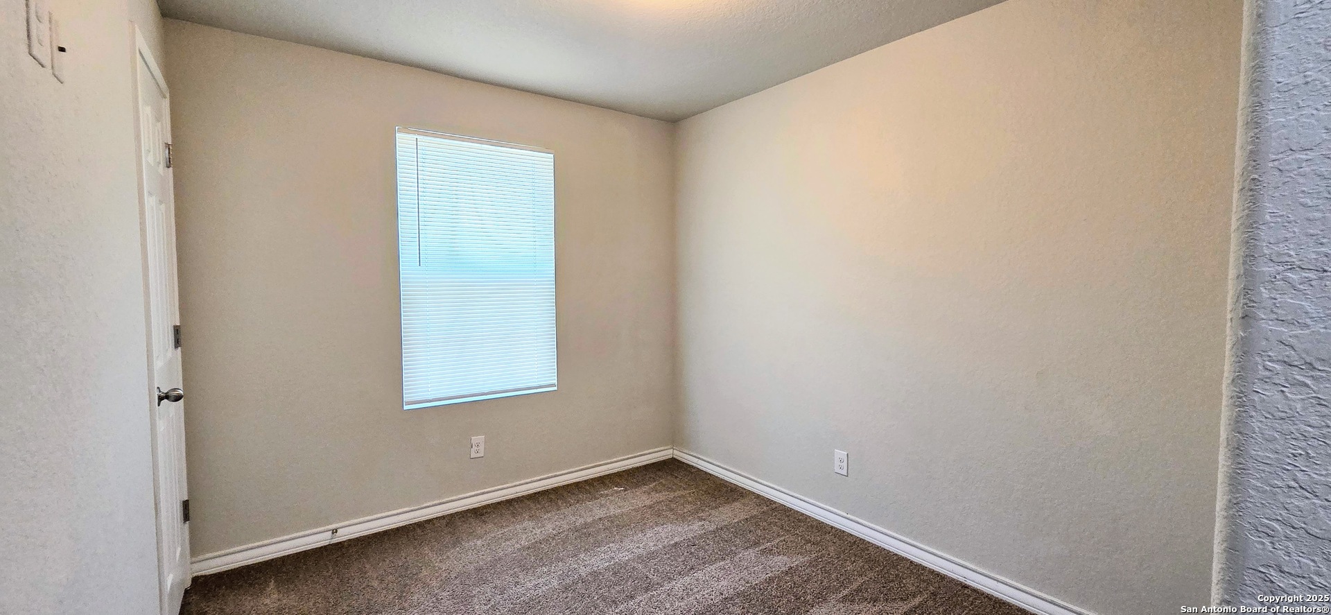 16906 Dancing Ava, Unit 1 Selma, TX 78154 - Photo 5 of 7 an empty room with windows