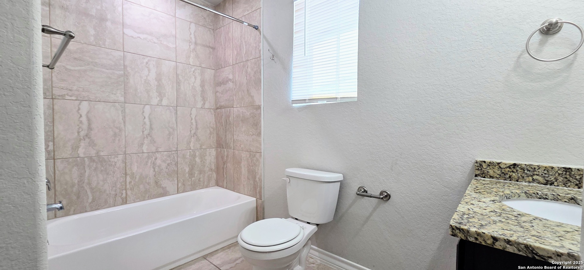 16906 Dancing Ava, Unit 1 Selma, TX 78154 - Photo 6 of 7 a bathroom with a toilet and a bathtub