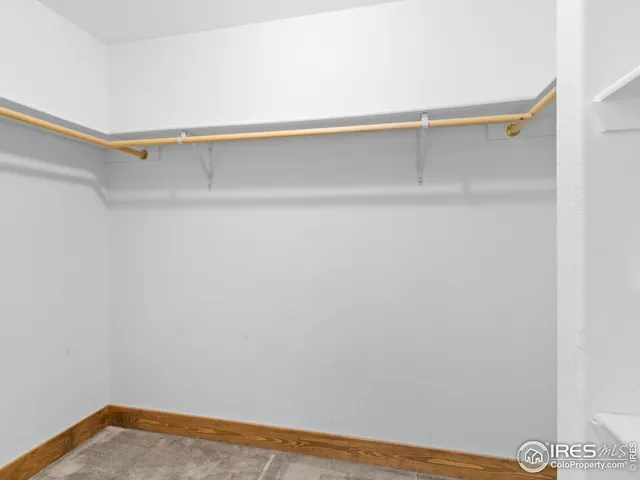 a view of a room with shelf on the wall