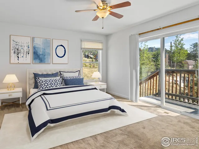 a spacious bedroom with a bed and a large window