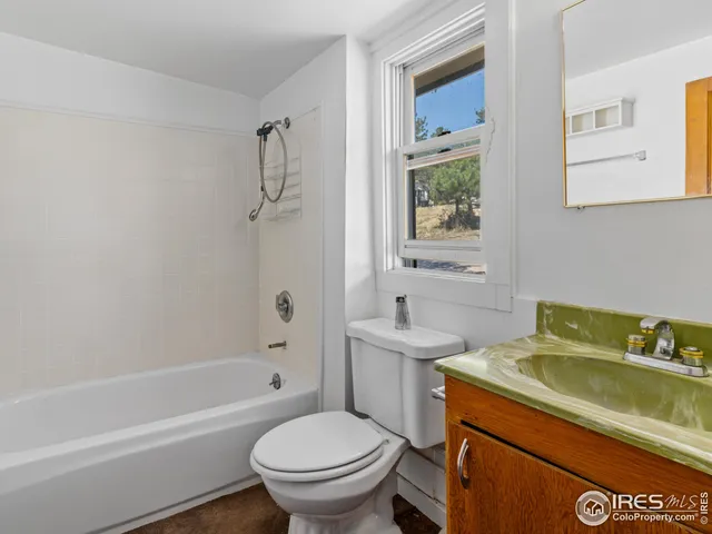 a kitchen with stainless steel appliances granite countertop a refrigerator a sink and a stove