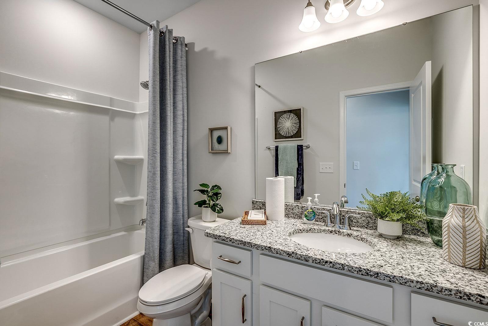 240 Wagner Circle Conway, SC 29526 - Photo 18 of 26 Bathroom with toilet, vanity, and shower / tub combo