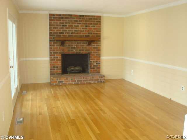 3811 Pebble Creek Road Midlothian, VA 23112 - Photo 5 of 12 a view of empty room with a fireplace