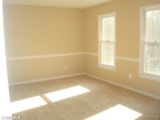 3811 Pebble Creek Road Midlothian, VA 23112 - Photo 7 of 12 a view of an empty room with a window