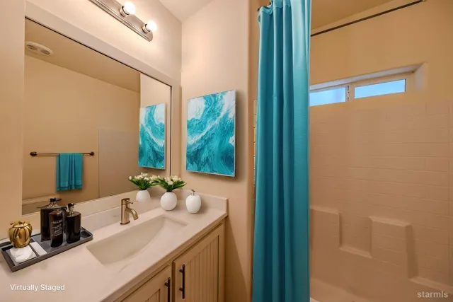 a view of storage and utility room with window