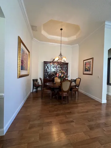 a living room with fireplace furniture and a large window