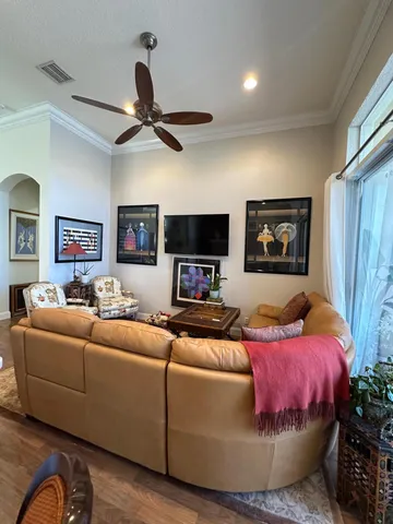 a kitchen with stainless steel appliances granite countertop a refrigerator a sink a stove and a refrigerator