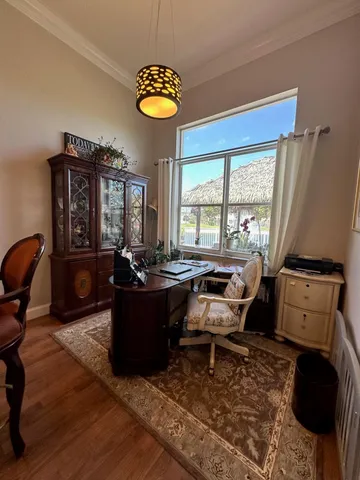a view of a livingroom with furniture and staircase