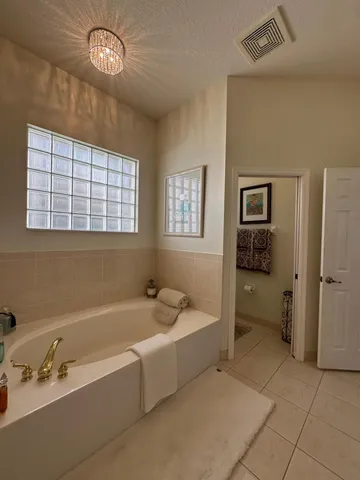 a view of a hallway view with wooden floor and furniture