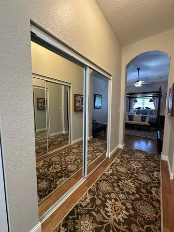 a living room with furniture and a rug