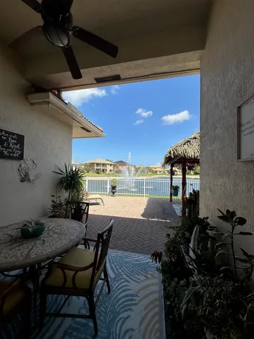 a view of a backyard with sitting area and furniture