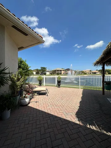 a view of a backyard with potted plants