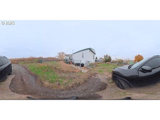 941 Southeast 9th Street Pendleton, OR 97801 - Photo 15 of 36 a backyard of a house with table and chairs