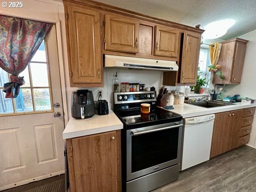 941 Southeast 9th Street Pendleton, OR 97801 - Photo 18 of 36 a kitchen with stainless steel appliances granite countertop a stove a sink and a microwave