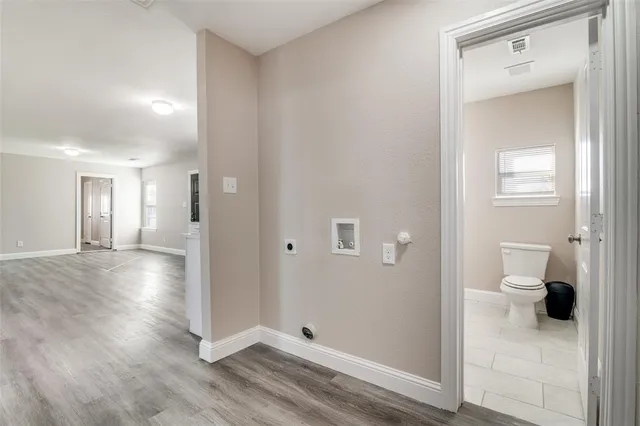 a view of a bathroom from a hallway