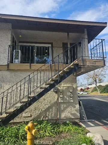 a view of a balcony with two chairs