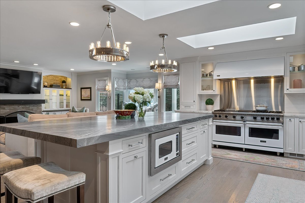 45 Woodley Road Winnetka, IL 60093 - Photo 24 of 61 a kitchen with stainless steel appliances a stove sink and cabinets