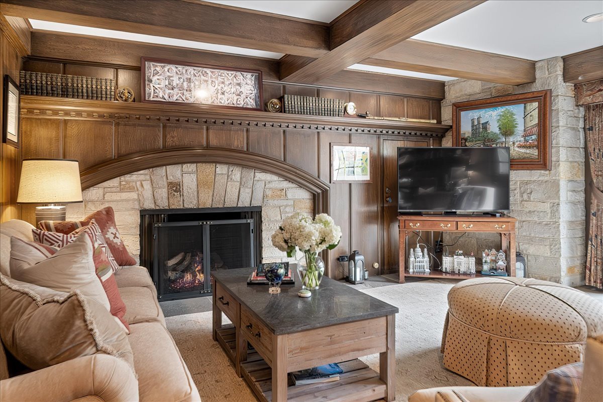 45 Woodley Road Winnetka, IL 60093 - Photo 38 of 61 a living room with furniture and a fireplace