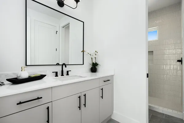 a bathroom with a sink and a mirror