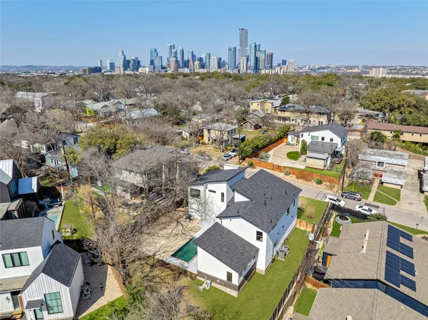an aerial view of a house with a yard