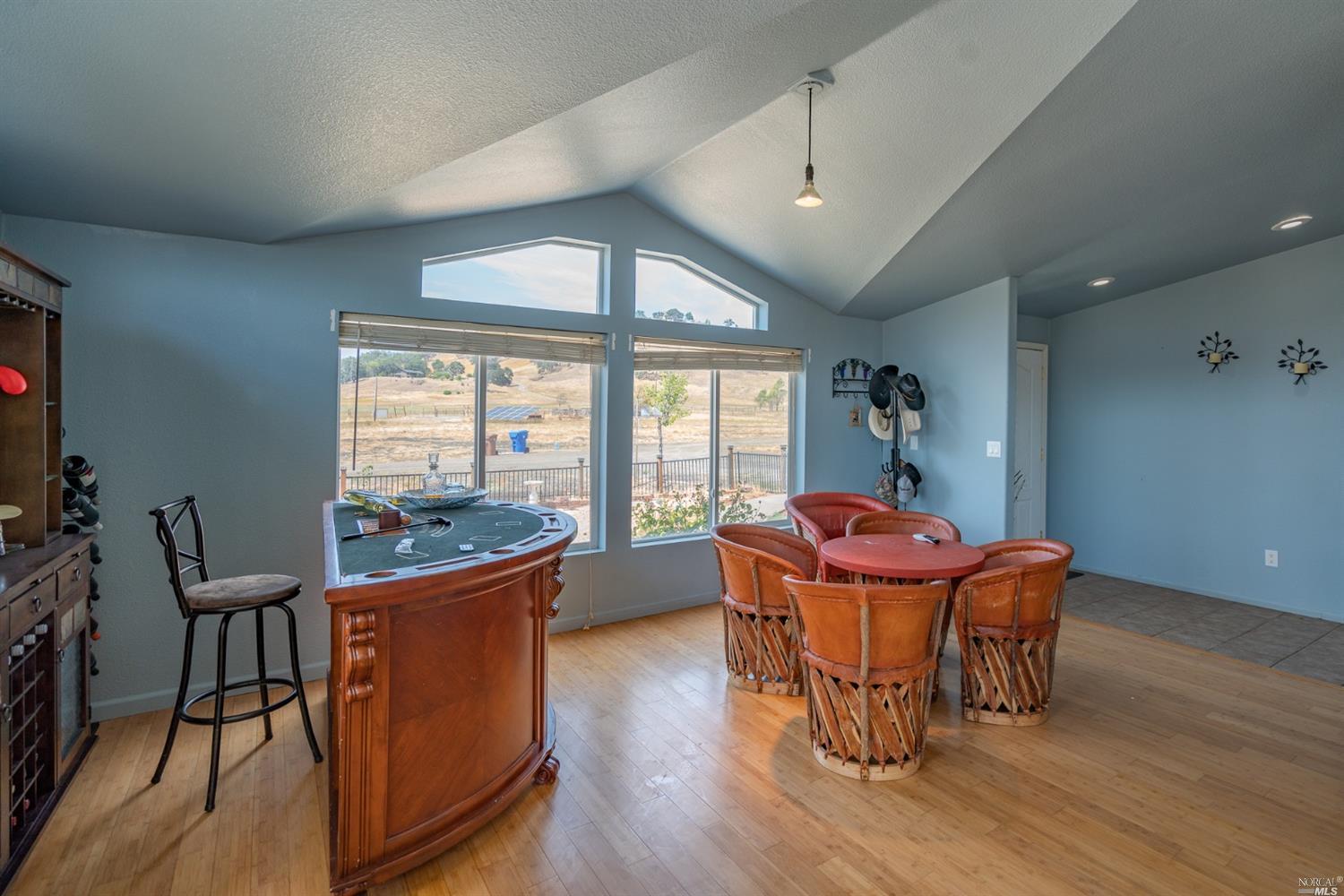 21080 Loconomi Road Middletown, CA 95461 - Photo 1 of 1 a dining room with furniture large windows and wooden floor