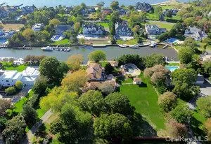 an aerial view of residential house with outdoor space and lake view