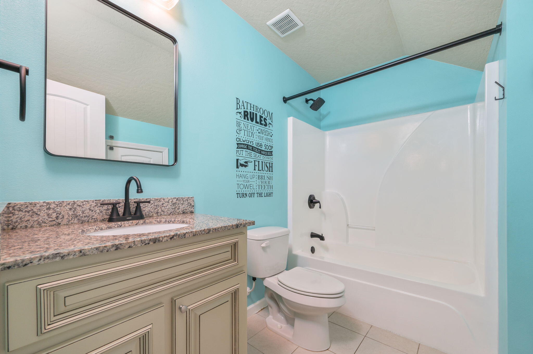 5275 Moore Loop Crestview, FL 32536 - Photo 26 of 32 a bathroom with a granite countertop sink toilet and shower