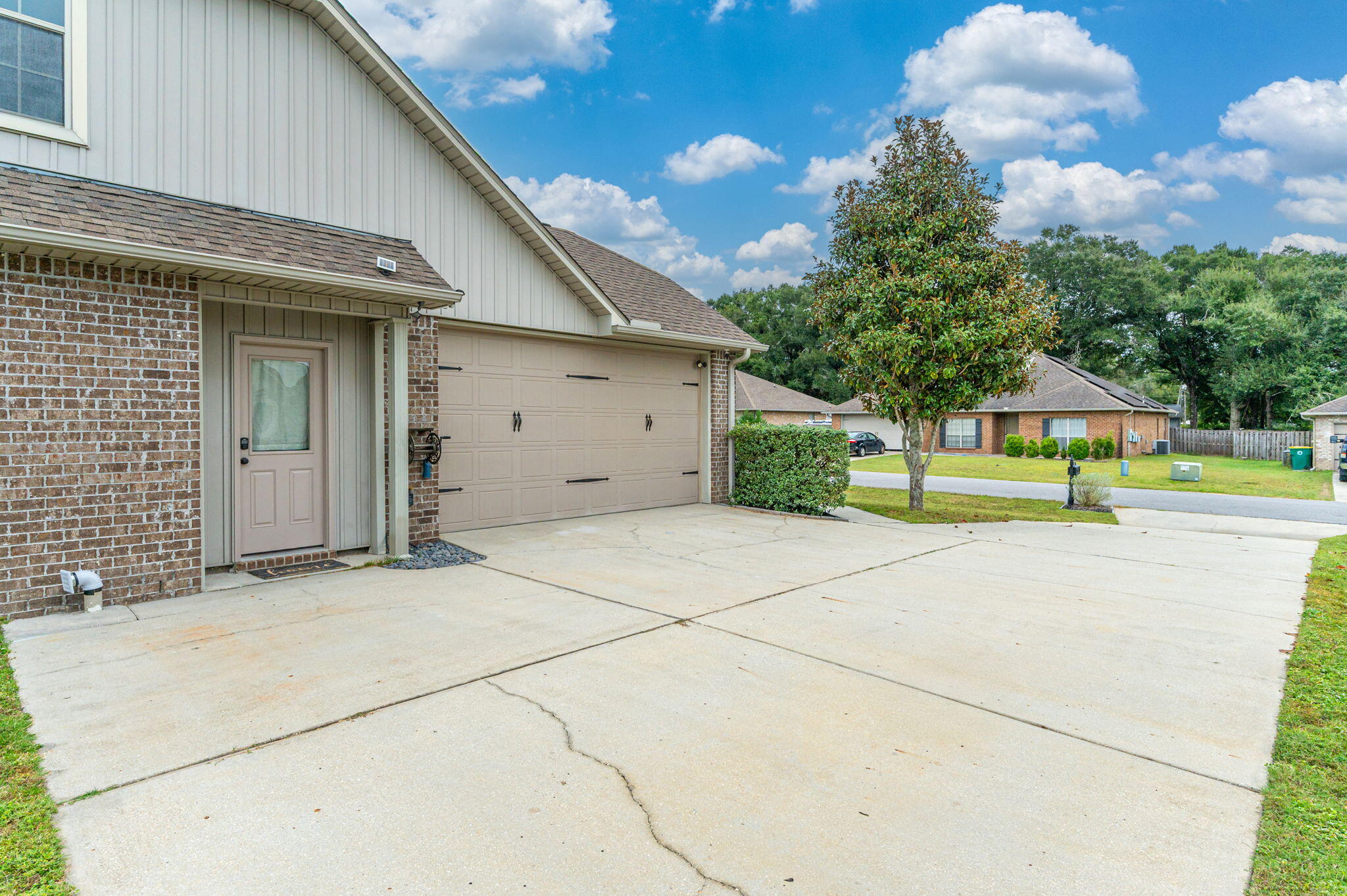 5275 Moore Loop Crestview, FL 32536 - Photo 4 of 32 a view of a house with a yard and garage