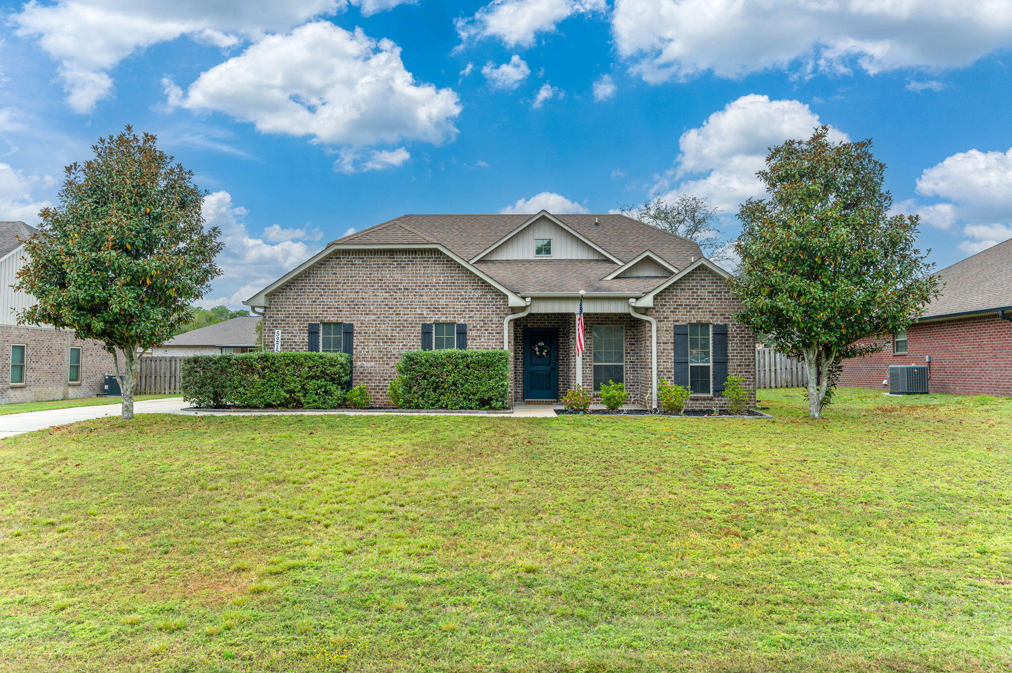 5275 Moore Loop Crestview, FL 32536 - Photo 5 of 32 a front view of a house with a garden