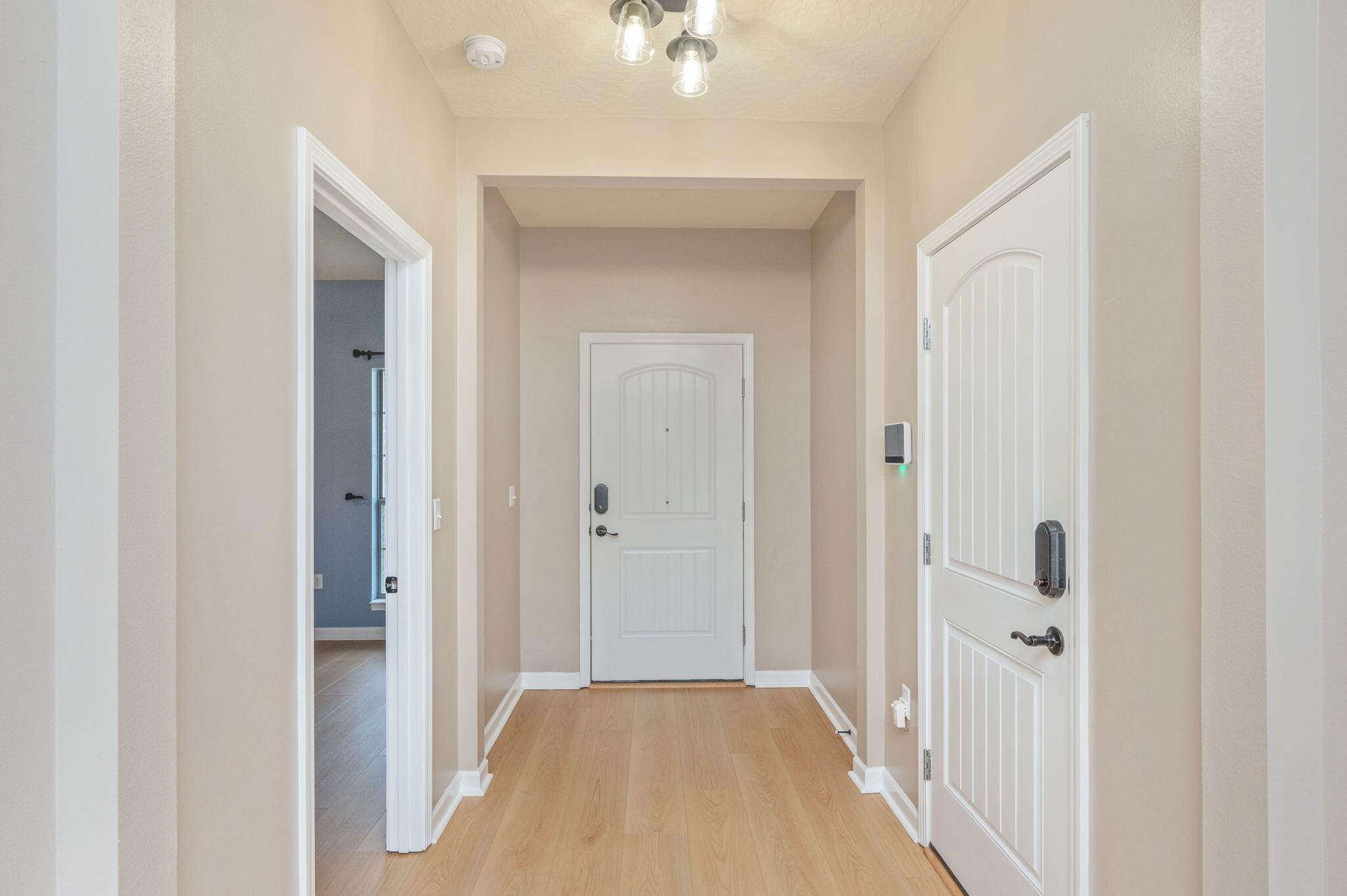 5275 Moore Loop Crestview, FL 32536 - Photo 7 of 32 a view of a bathroom from a hallway