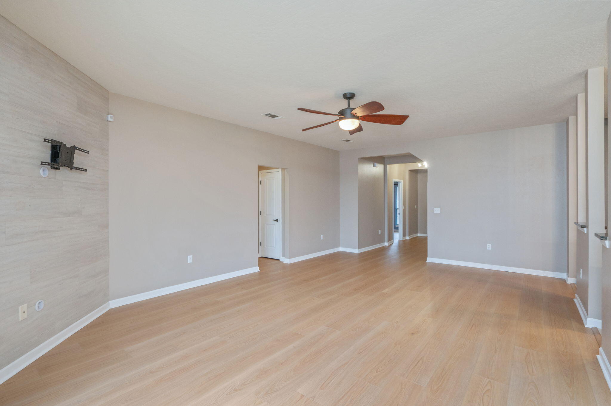 5275 Moore Loop Crestview, FL 32536 - Photo 10 of 32 a view of an empty room with a chandelier fan