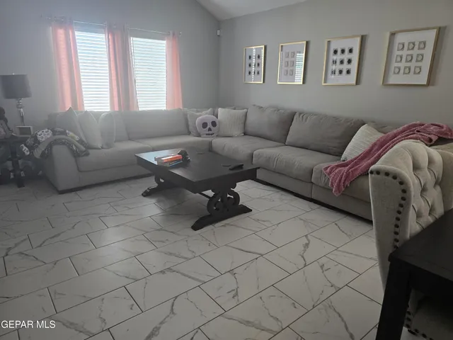 a living room with furniture and a couch