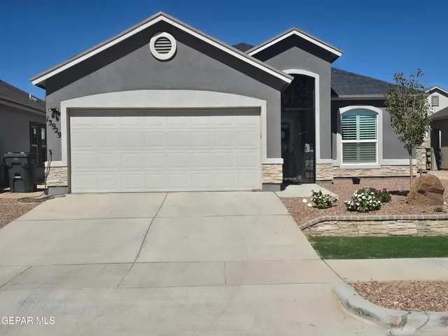 a front view of a house with yard