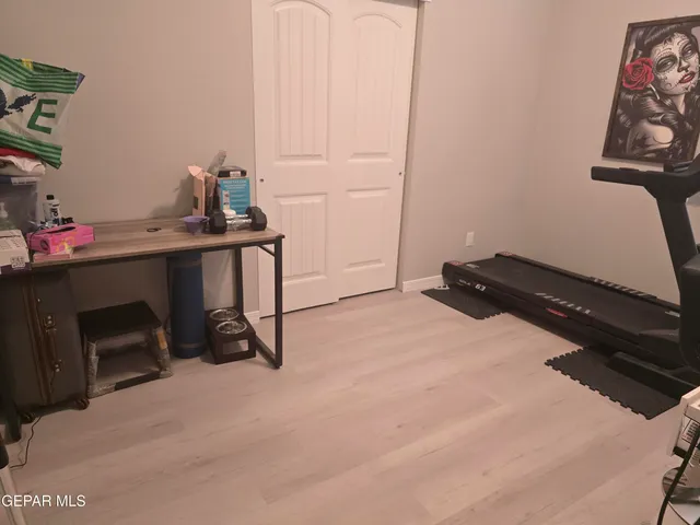 a bathroom with a granite countertop toilet sink and mirror
