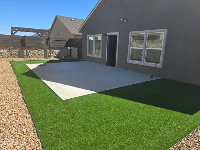 a backyard of a house with lots of green space