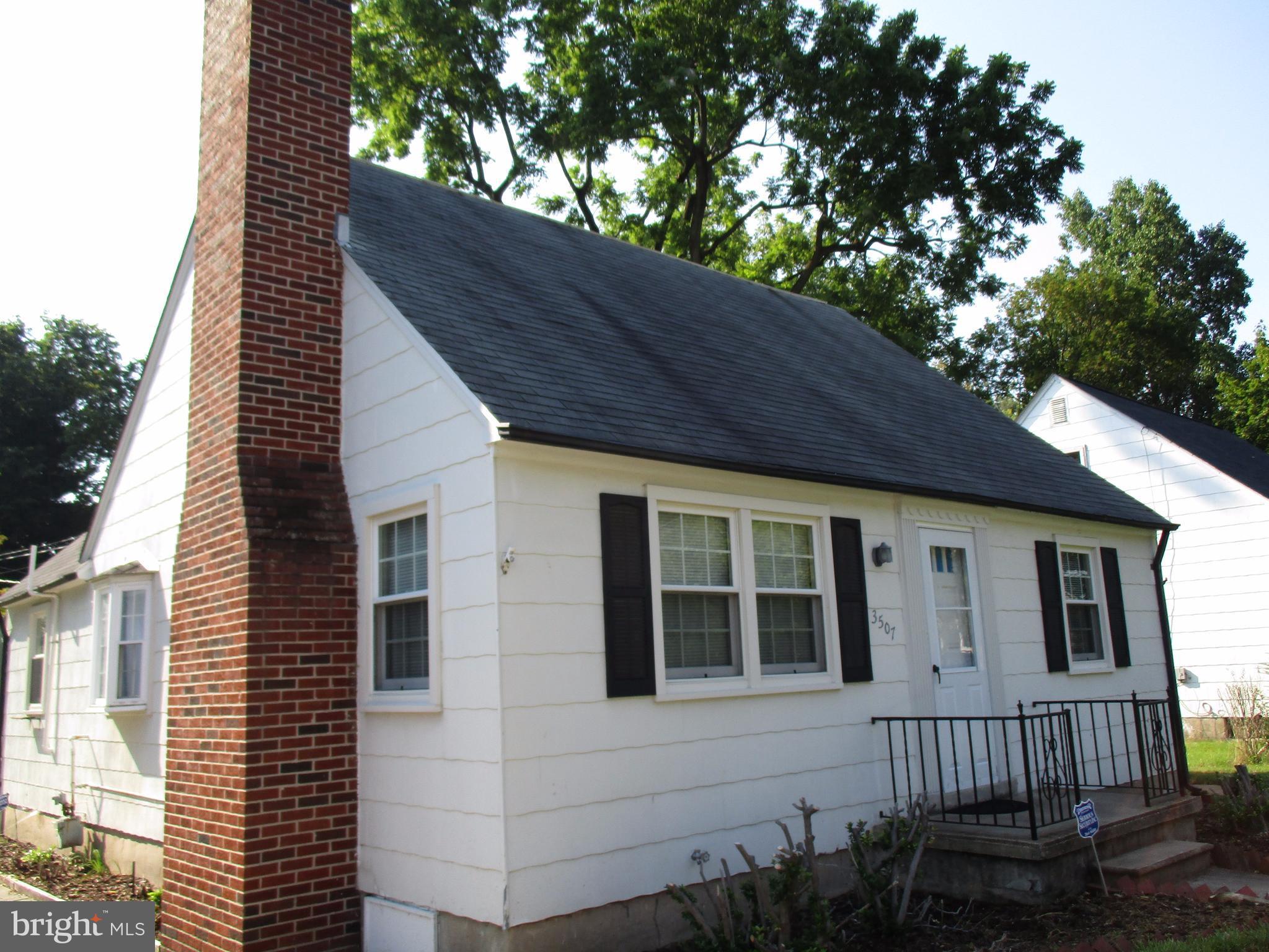 3507 Rolling Rd. Baltimore, MD 21244 - Photo 3 of 8 a view of a house with a small yard