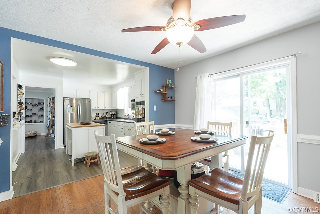 3825 Frankmont Road Richmond, VA 23234 - Photo 13 of 47 a view of a dining room with furniture window and wooden floor