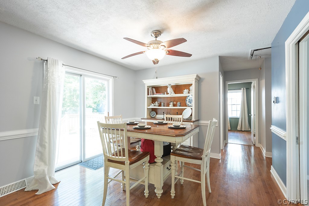 3825 Frankmont Road Richmond, VA 23234 - Photo 14 of 47 a view of a dining room with furniture window and wooden floor