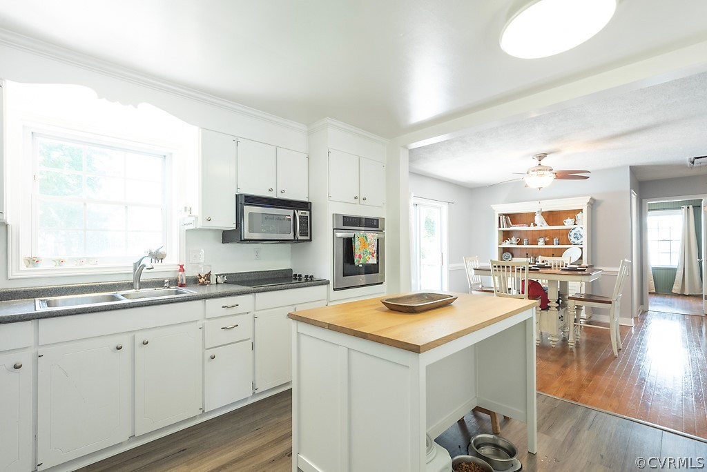 3825 Frankmont Road Richmond, VA 23234 - Photo 18 of 47 a open kitchen with sink cabinets and wooden floor