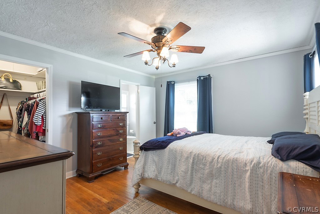 3825 Frankmont Road Richmond, VA 23234 - Photo 26 of 47 a bedroom with a bed and a flat tv screen on dresser