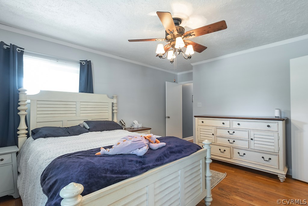 3825 Frankmont Road Richmond, VA 23234 - Photo 27 of 47 a bedroom with a bed and a chandelier