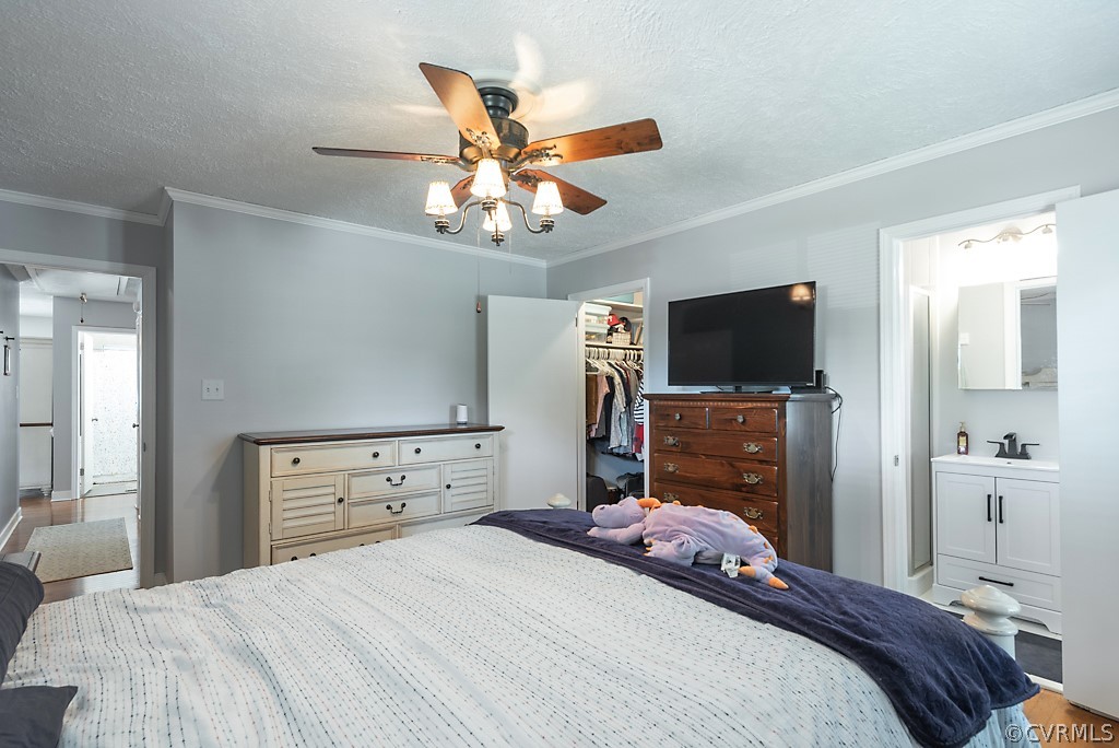3825 Frankmont Road Richmond, VA 23234 - Photo 28 of 47 a bedroom with a bed and a flat tv screen on dresser