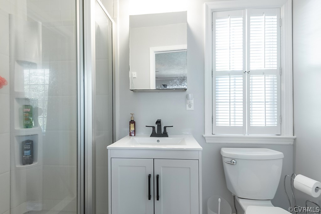3825 Frankmont Road Richmond, VA 23234 - Photo 29 of 47 a bathroom with a toilet sink and mirror