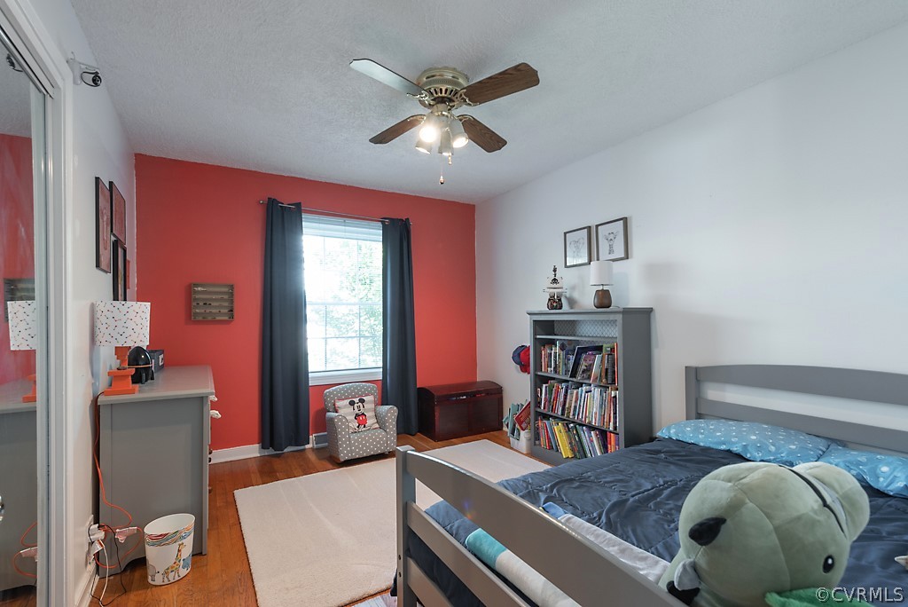 3825 Frankmont Road Richmond, VA 23234 - Photo 31 of 47 a living room with furniture and wooden floor