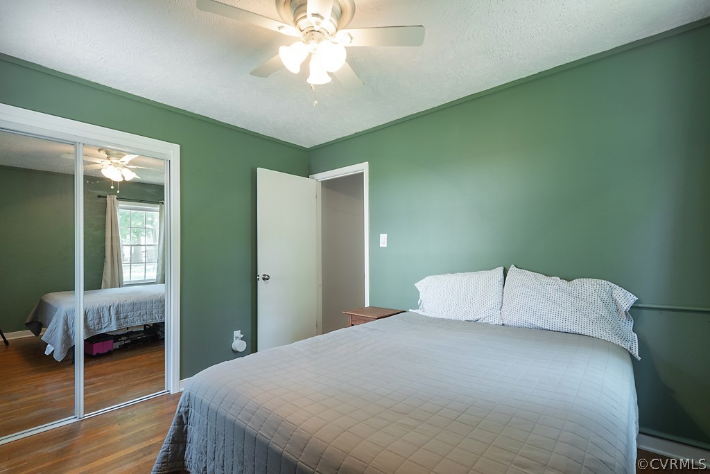 3825 Frankmont Road Richmond, VA 23234 - Photo 34 of 47 a bedroom with a bed and a chandelier